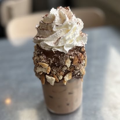 Iced mocha topped with whipped cream at Hash House