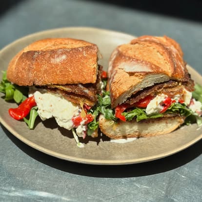 Sandwich with burrata, greens and roasted peppers at Hash House