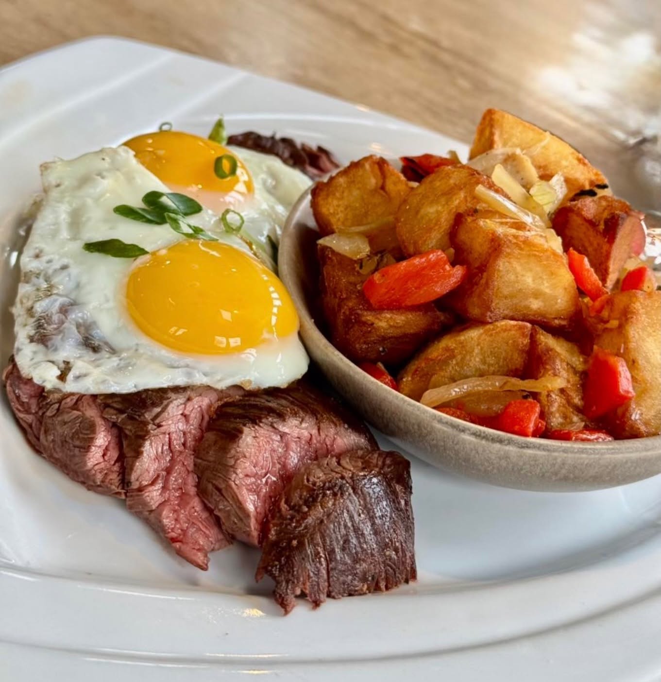 Steak and eggs with roasted breakfast potatoes at Hash House