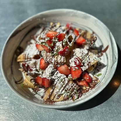Strawberry Nutella crepes dusted with powdered sugar at Hash House